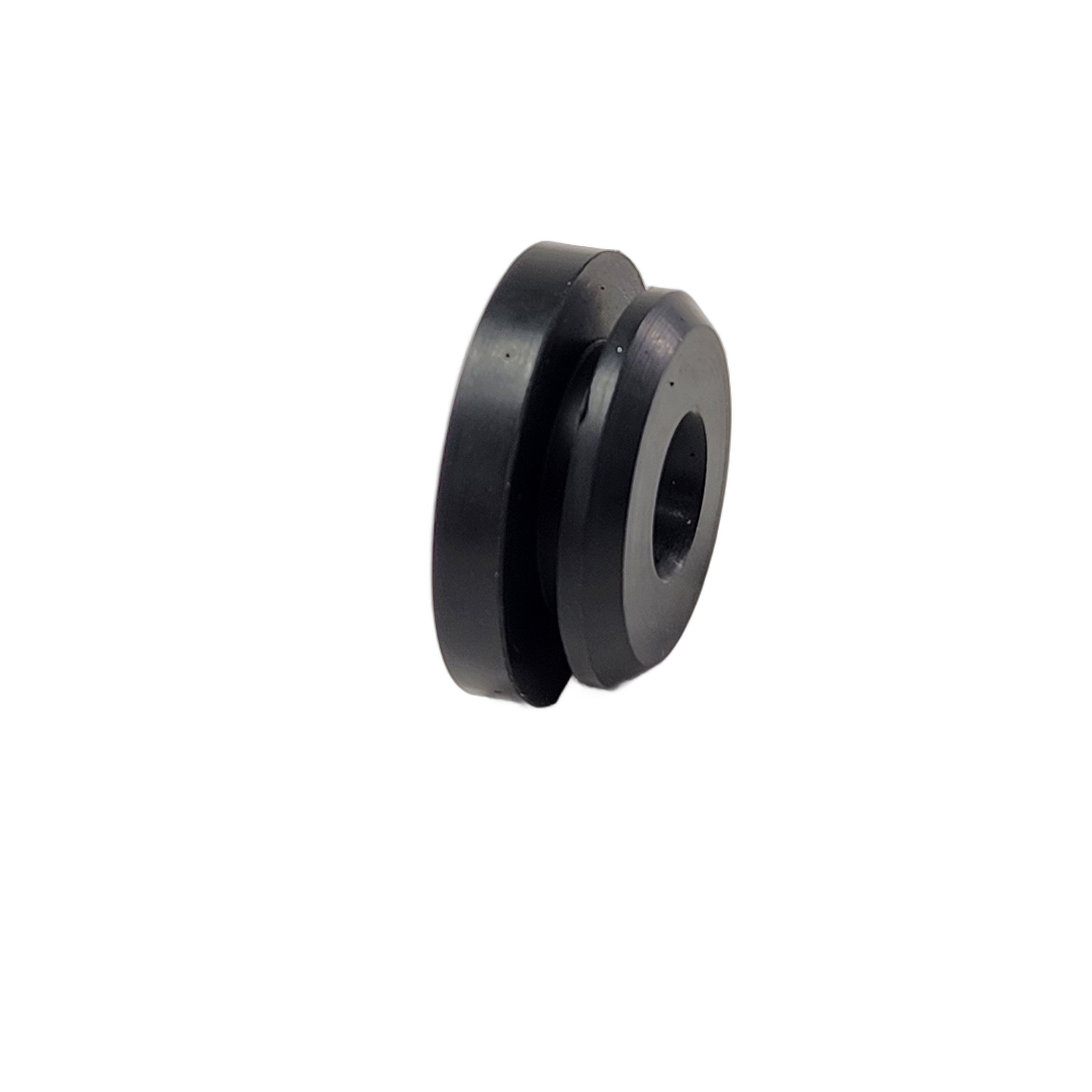 Black cylindrical rubber damper with central hole and grooved outer edge.