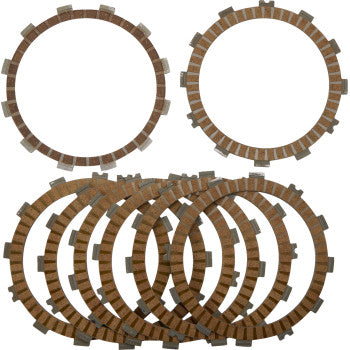 Eight circular brown and gray Clutch Friction Plates by Moose Offroad, made from heat-resistant material, are arranged overlapping in a row, with two similar plates placed above them on a white background.