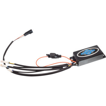 The Indian Illuminator Module - Front by Badlands is a rectangular black unit with an attached label, connected to black cables with white connectors and orange wires—ideal for Indian vehicles’ front turn signals or as a control component.
