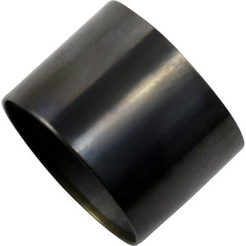A black, cylindrical Valve Spring Bucket by Xceldyne with a DLC coating and a beveled edge is shown against a white background.