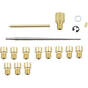 The Honda Jet Kit Stage 1/2 by Dynojet includes assorted brass carburetor nozzles, screws, rods, washers, and clips for full adjustability and improved performance, all neatly arranged on a white background.