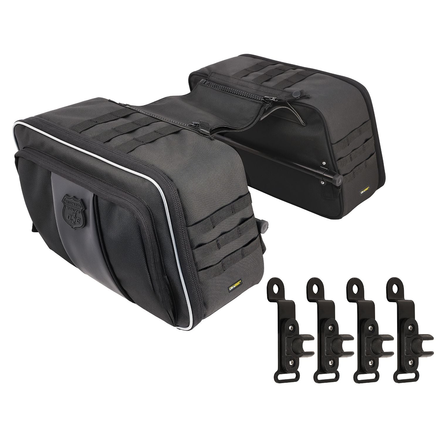The Route 1 Road Trip Saddlebags by Nelson Rigg are black, waterproof motorcycle bags with reflective piping, MOLLE webbing, and four mounting brackets—ideal as Harley Softail saddlebags for added UV protection.