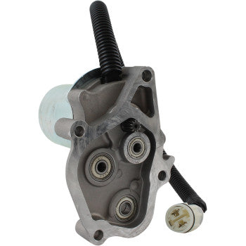 Gray metal shift control motor with three circular gears and black flexible cable ending in a white plastic connector.