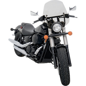 A black cruiser motorcycle features a Memphis Shades Pop Top Windshield - 7 Headlight Cut Out - Solar, chrome exhaust pipes, and two rearview mirrors, viewed from the front-left angle.