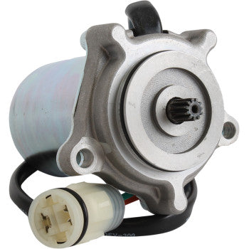 Compact silver metal shift control motor with gear shaft and attached black cable with white plastic connector.