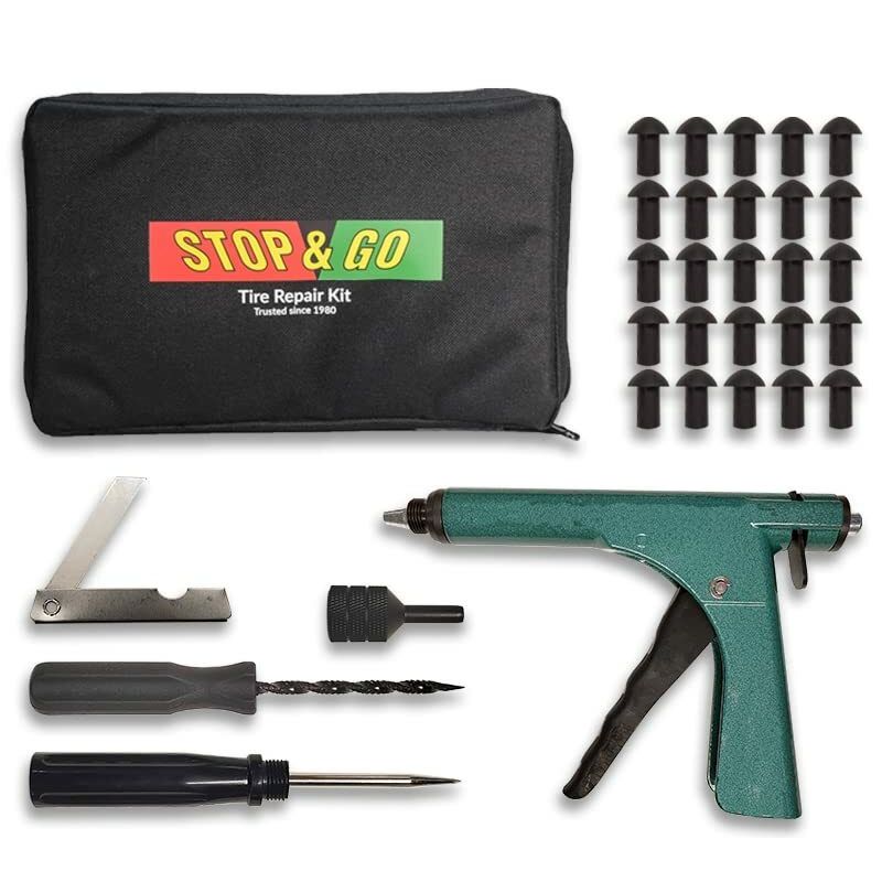 The Std Model Tire Plugger Kit by Stop & Go features a zippered pouch, 20 black mushroom plugs, teal-handled tool, screwdriver, probe, rasp, reamer, and a black circular adapter—all neatly organized.