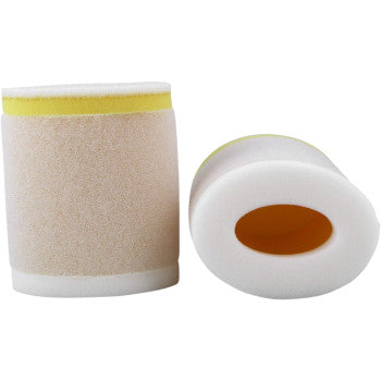 Two cylindrical Suzuki Foam Air Filters by No Toil, featuring white and yellow layers—one upright, one on its side showing the hollow center—demonstrate an effective air filtration system.