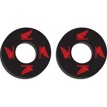 Pair of black circular grip donuts with red Honda wing logos and text, designed for offroad use.