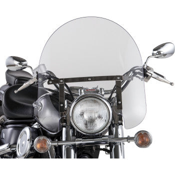 A front view of a motorcycle with the Slipstreamer Classic Windshield - 17 - Standard - Clear, Quick Release mount, round headlight, two side mirrors, chrome handlebars, and indicators.