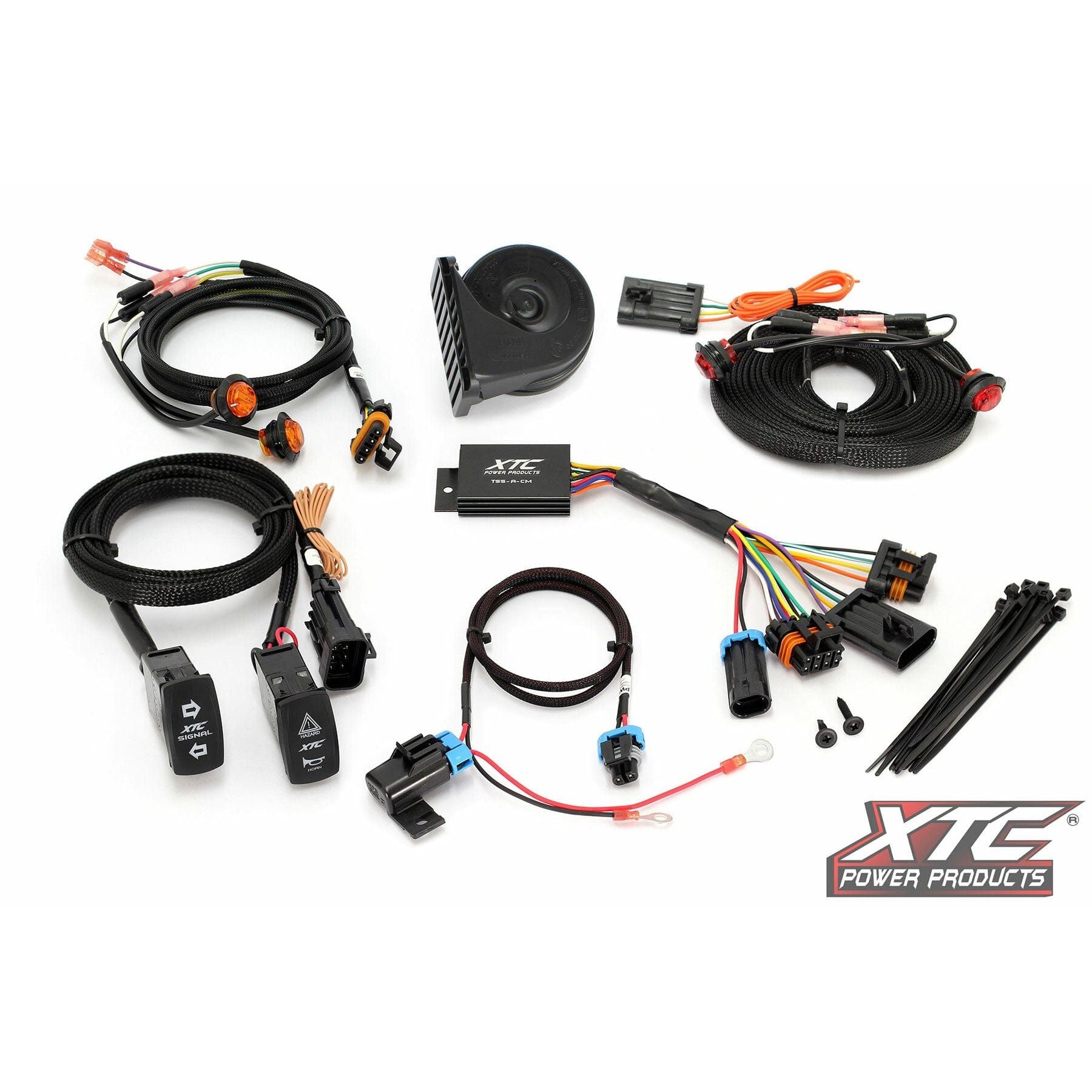 The Self Canceling Turn Signal Kit Universal with 3/4 tail lights by XTC Power, including wiring harness components, switches, connectors, zip ties, a horn, and control module for easy installation, is displayed on a white background with the XTC Power Products logo at the bottom right.