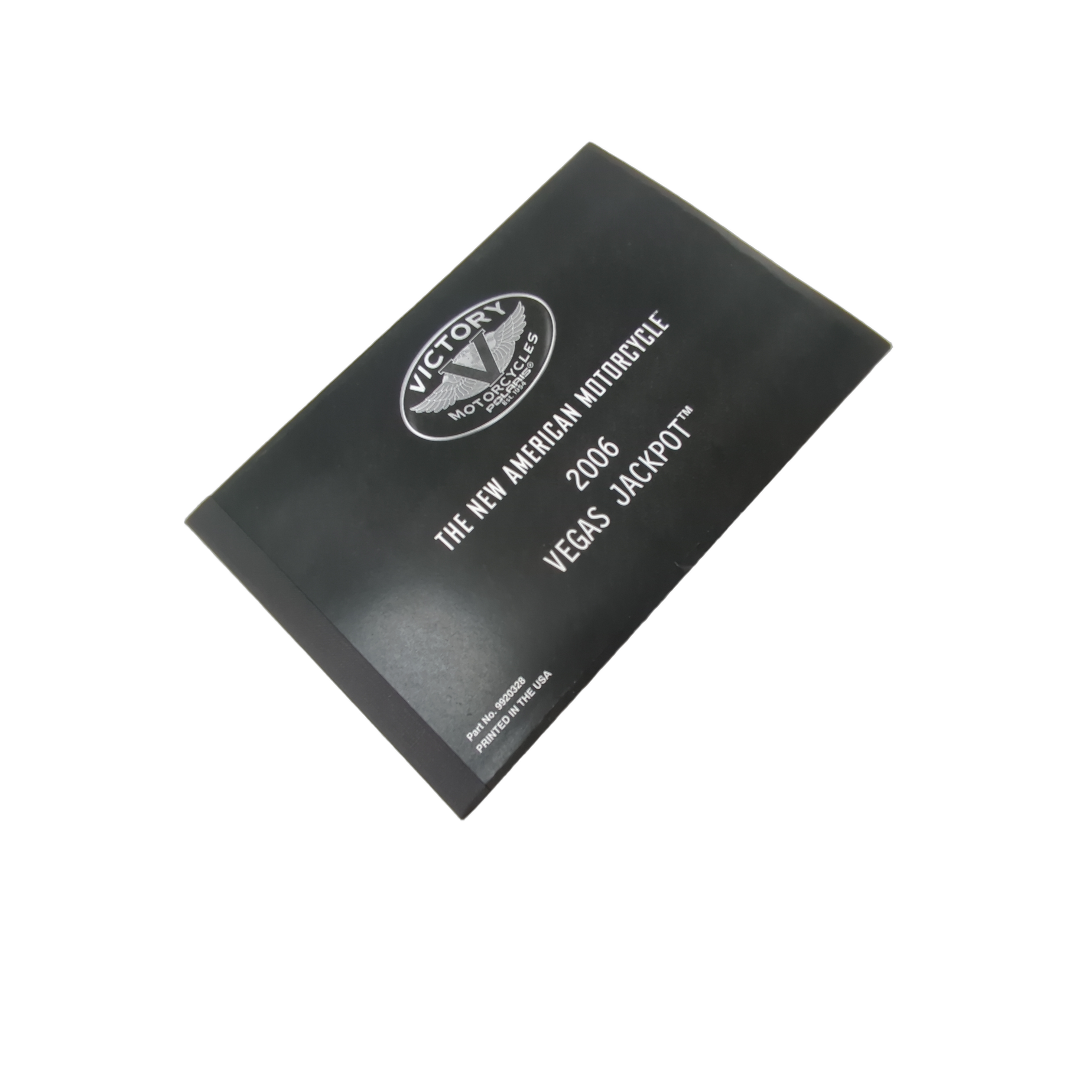 Black booklet with white text and Victory Motorcycle logo, titled 2006 Vegas Jackpot Owner's Manual.