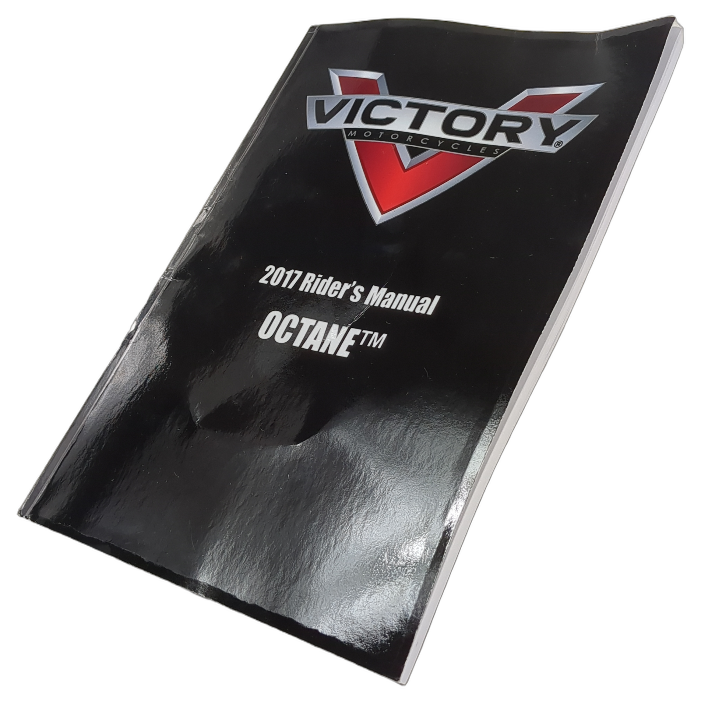Glossy black softcover manual with Victory logo and white text reading 2017 Rider’s Manual Octane.