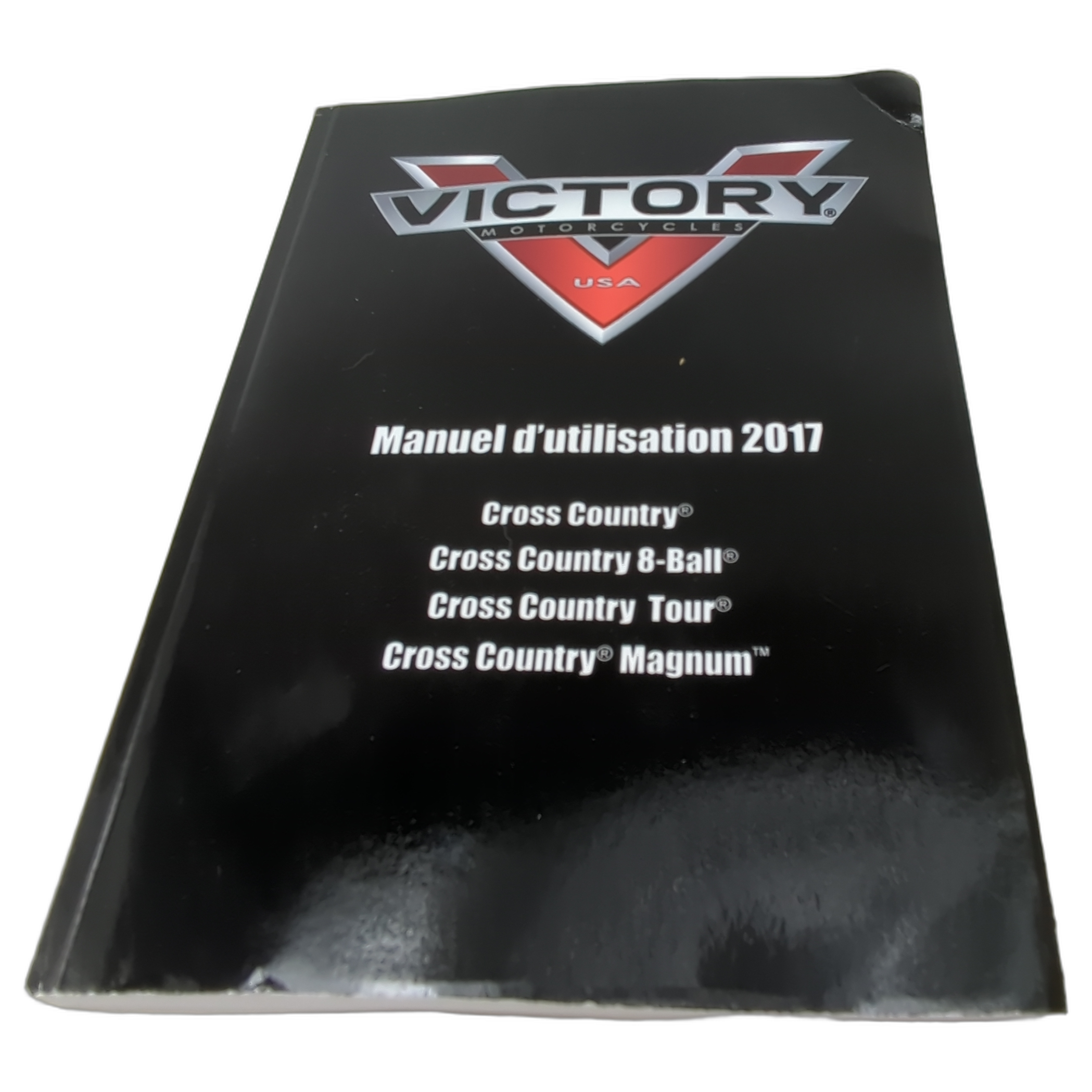 Black softcover 2017 Victory motorcycle owner's manual with red and silver logo and white French text on front.