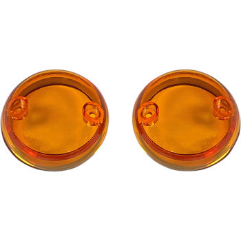 Two round, translucent amber ProBEAM® Lenses by Custom Dynamics, each with a small raised circle and an off-center hole, are side by side on a white background.