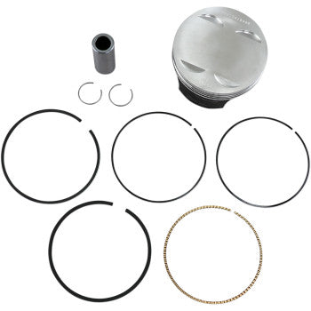 The Honda Piston Kit 104.00 mm by Wiseco includes a silver piston, four black rings, a wrist pin, two circlips, and a thin gold oil ring, all displayed on a white background. Proudly made in the USA.