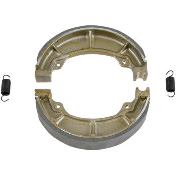A pair of radius-ground, metallic semicircular Brake Shoes by Ebc with grooved surfaces, positioned to form a circle, includes two original-style black brake shoe springs—one on each side.
