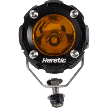 The Spotlight Amber by Heretic is a round, black off-road LED light featuring an amber lens, four silver screws, Cree LEDs, the Heretic brand on the front, and a bottom aircraft-grade aluminum mounting bracket.