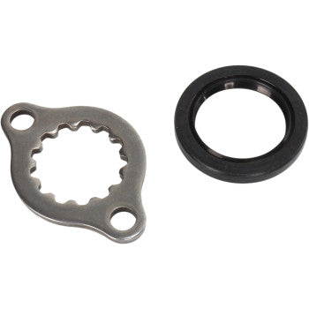 Metal Honda transmission output shaft seal plate with gear-like inner edge and black rubber circular seal ring.