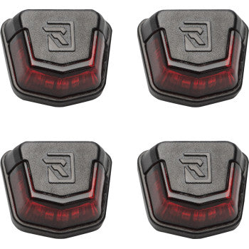 Set of four black plastic Can Am Defender trunk bed lights with red transparent lens and embossed R logo on top.