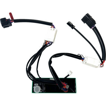 The Honda Talon Module Run Turn Brake by Custom Dynamics is a black wiring harness with plug-and-play connectors, easily connecting to a green rectangular circuit board for seamless integration into rear brake light or custom brake flash systems.