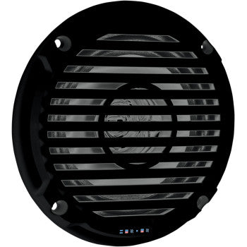 The 5.25" Marine Grade Speaker by Jensen is a round, black unit with a protective grille secured by four screws, featuring a polypropylene woofer and four small indicator lights at the bottom center of the grille.