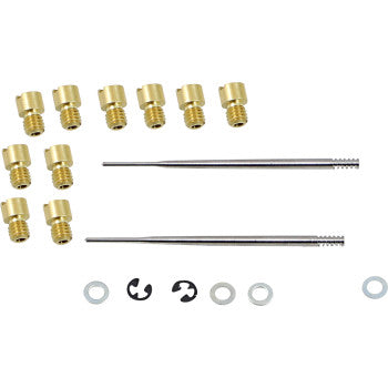 The Kawasaki Jet Kit Stage 1 by Dynojet includes small brass nozzles, thin metal rods, black clips, metal washers, and a small ring—perfect for stock engine upgrades or adjustable setups—displayed neatly on a white background.