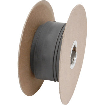 The Heat Shrink Tube - 11/16 x 50 by DEI comes on a spool with brown cardboard ends and black tubing wound around the center, commonly used for packaging wire, cable, or electrical insulation.