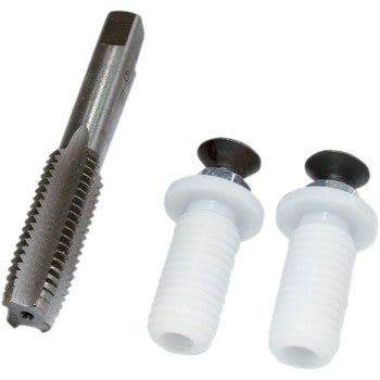 The Barrel Spring Black by Whipitlightrods is shown next to a metal thread tap and two white plastic wall anchors with black screws partially inserted, all displayed on a white background.