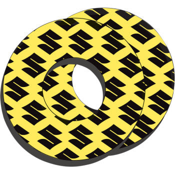 Pair of yellow round grip donuts with repeating black Suzuki logo pattern, made from durable material.