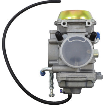 Silver metal Polaris replacement carburetor with round clear fuel inlet and attached black rubber hose.