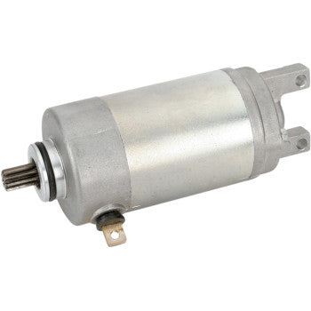 The Yamaha Starter Motor by Rick's Motorsport Electric is a silver cylindrical aftermarket starter with a small gear, two mounting brackets, and a metal terminal. It features double-sealed ball bearings for enhanced durability.