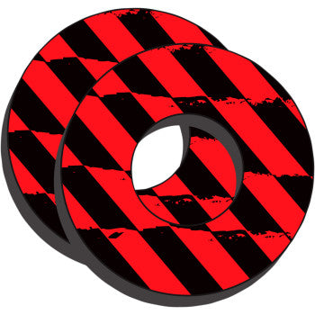 Pair of round black foam grips with red and black diagonal caution stripes and central holes for mounting.