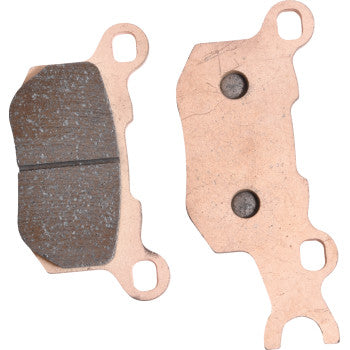 The Sintered Brake Pads by All Balls feature one pad with a grooved friction surface for superior stopping power and another with a flat backing plate that has two circular indents and three mounting holes.