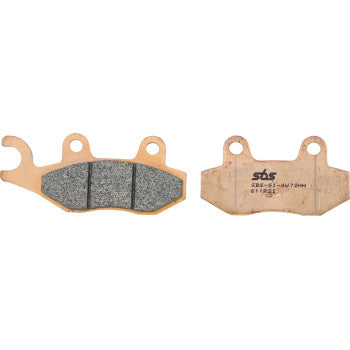 Two Brake Pads by Sbs are shown side by side—one reveals the advanced sintered EVO compound friction surface, while the other displays its back plate with printed text and two mounting holes for enhanced UTV performance.