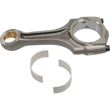 Metal connecting rod with large and small circular ends, accompanied by two curved bearing inserts.