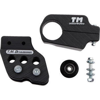 The Yamaha Banshee Chain Guide Slider Black by T.M. Designworks includes two branded black metal parts—a rear chain guide with three bolts—plus a small wheel, screws, and bolts. Perfect for smooth performance with your dirt cross chain slider.