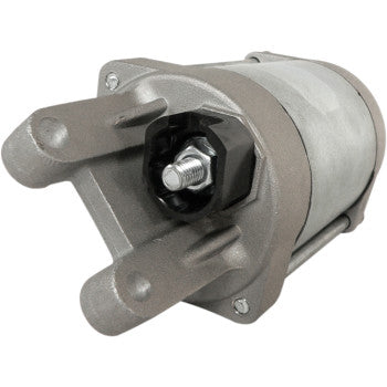 A close-up of the Starter Motor by Parts Unlimited shows visible mounting brackets and copper bushings, isolated on a white background.