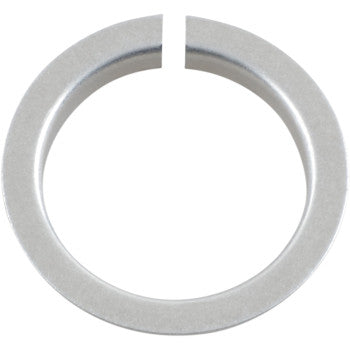 The Shock Collar Adapter by Race Tech is a metallic circular washer with a small gap, similar to a split ring, shown from above on a white background—perfect for use as a shock collar adapter or in rear shock applications.