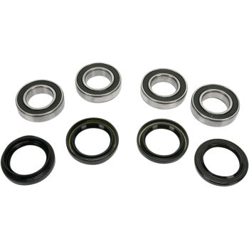 The Yamaha - Kymco Wheel Bearing Kit Front by Pivot Works includes four double-sealed metal ball bearings and four black rubber seals, arranged in two rows on a white background with bearings above the seals.