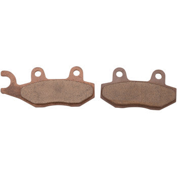 Two Kawasaki Sintered Brake Pads by DP Brakes are shown side by side, each with a copper/bronze finish, two mounting holes at the top, and slightly different left-side shapes—perfect as ATV brake pads.