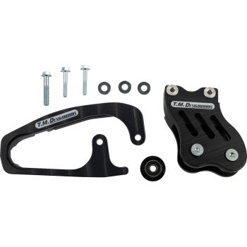 Honda TRX Chain Guide Slider Black by T.M. Designworks, with powerlip roller, mounting hardware (three bolts, three washers), and roller wheel, all displayed on a white background.