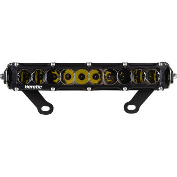 The Shock Tower Light 10" by Heretic is a black and yellow rectangular LED light bar, mounted on two black brackets, crafted from aircraft grade aluminum and powered by high-performance CREE LEDs.