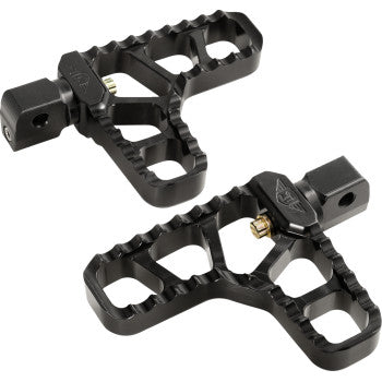 The Indian Serrated Heel Pegs - Black by Joker Machine are black metal footpegs with jagged edges, cutout patterns, a rectangular mounting section, and textured surfaces for superior grip, designed for Indian motorcycles or bikes.
