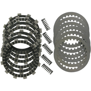 Set of black friction clutch plates, metallic steel plates with teeth, and small coiled springs arranged separately on white
