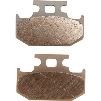 The Yamaha Standard Brake Pads by DP Brakes are two rectangular metallic sintered pads with chamfered edges, a diagonal line on the friction surface, and a central top tab for mounting—compatible with DP Brakes systems.