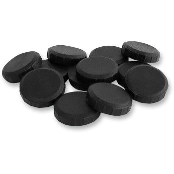 A pile of black hockey pucks, resembling the Can Am Clutch Button Kit by Epi, arranged haphazardly on a white background.