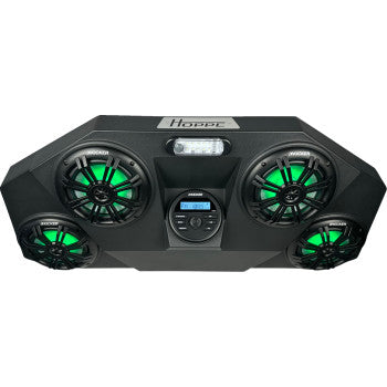 The Polaris RZR Pro Audio Shade RGB by Hoppe Industries features a black RGB LED speaker system with four round speakers with green lights, a central control panel with buttons and display, and a rectangular top light.