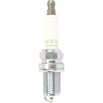The Ngk Spark Plugs BKR7E features a white ceramic insulator, hexagonal trivalent metal-plated base, and threaded end, displayed vertically against a white background.