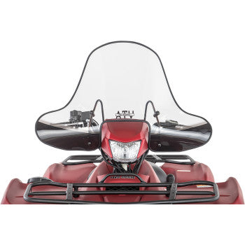 Front view of a red ATV fitted with the Big Country Windshield Xtreme 16 3/4 Cut Out by Slipstreamer, featuring a large polycarbonate windshield with quick-release mounting, handlebars, and headlight, set against a white background.