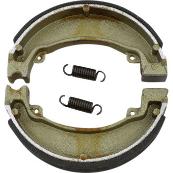Two semi-circular Brake Shoes by Dp Brakes, featuring black friction lining and two black coiled springs, are displayed in the center on a white background. The parts show slight rusting.